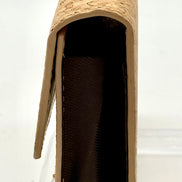 Side view Natural cork, accordion-style wallet with spacious interior that has 9 card pockets. 