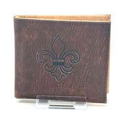 A slim, lightweight dark brown RFID protected bi-fold cork wallet that keeps your essentials organized without the bulk. fleur de lis
