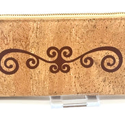 Cork wallet with decorative swirl design on a white background