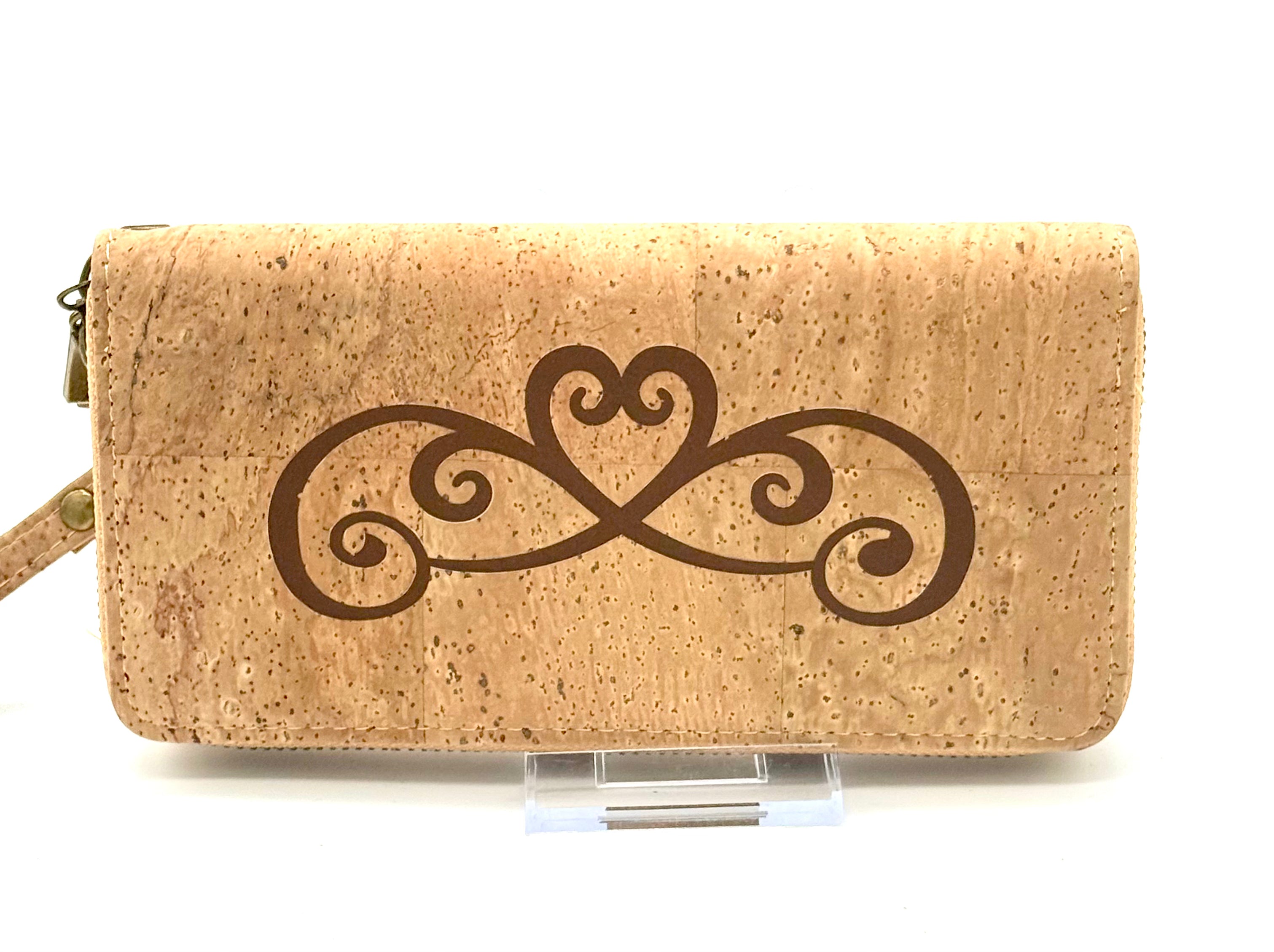 Cork wallet with decorative heart design on a white background
