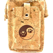Cork pouch with a yin yang design featuring a heart and paw print on a white background