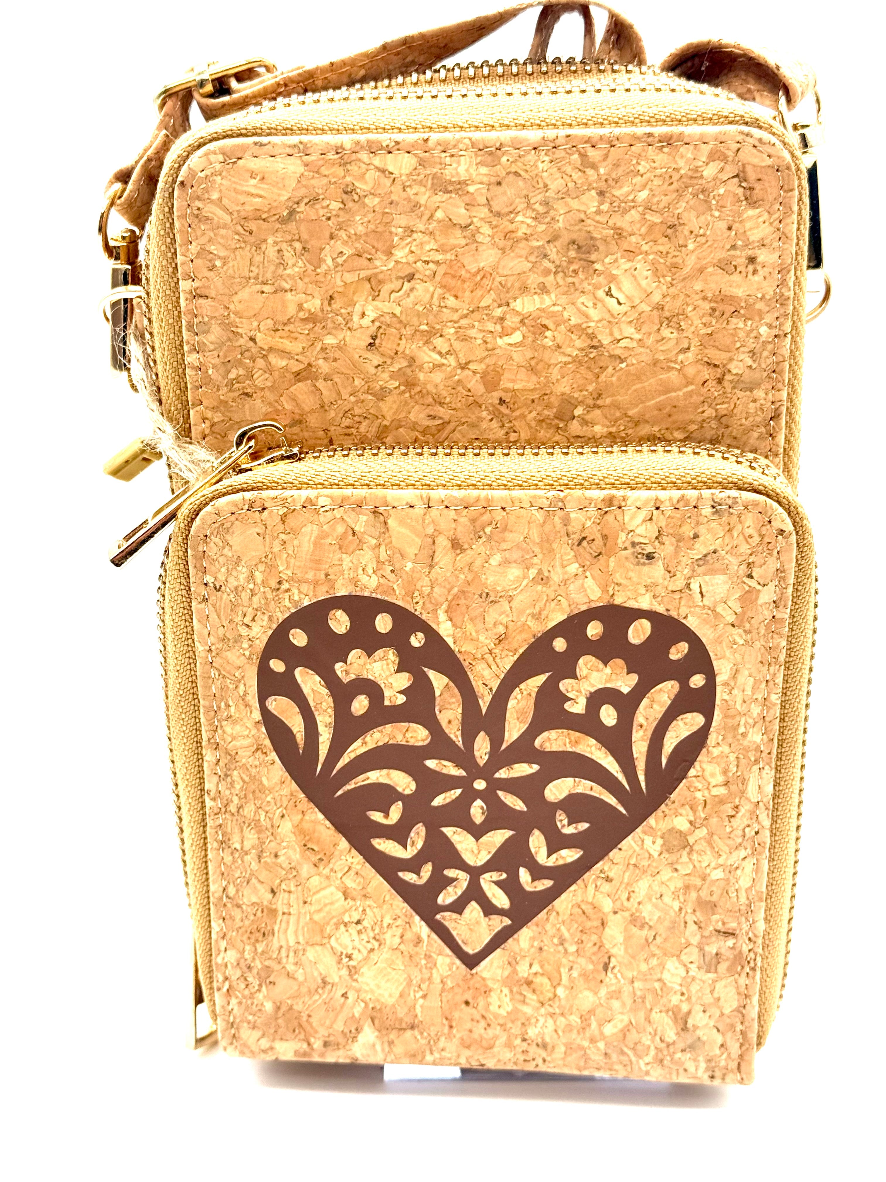 Cork handbag with a decorative heart cutout on a white background