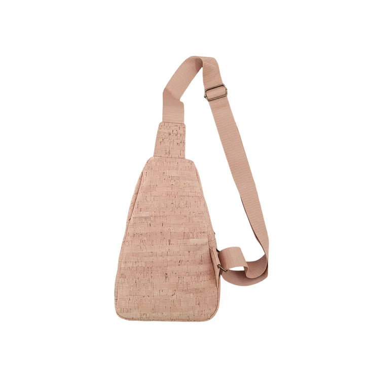 Back side of natural cork sling bag with wide adjustable woven stra