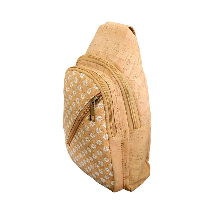 Natural cork sling bag with white daisy print and diagonal zip pocket