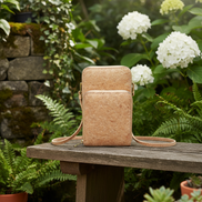 Natural cork crossbody phone bag with triple zipper design front view